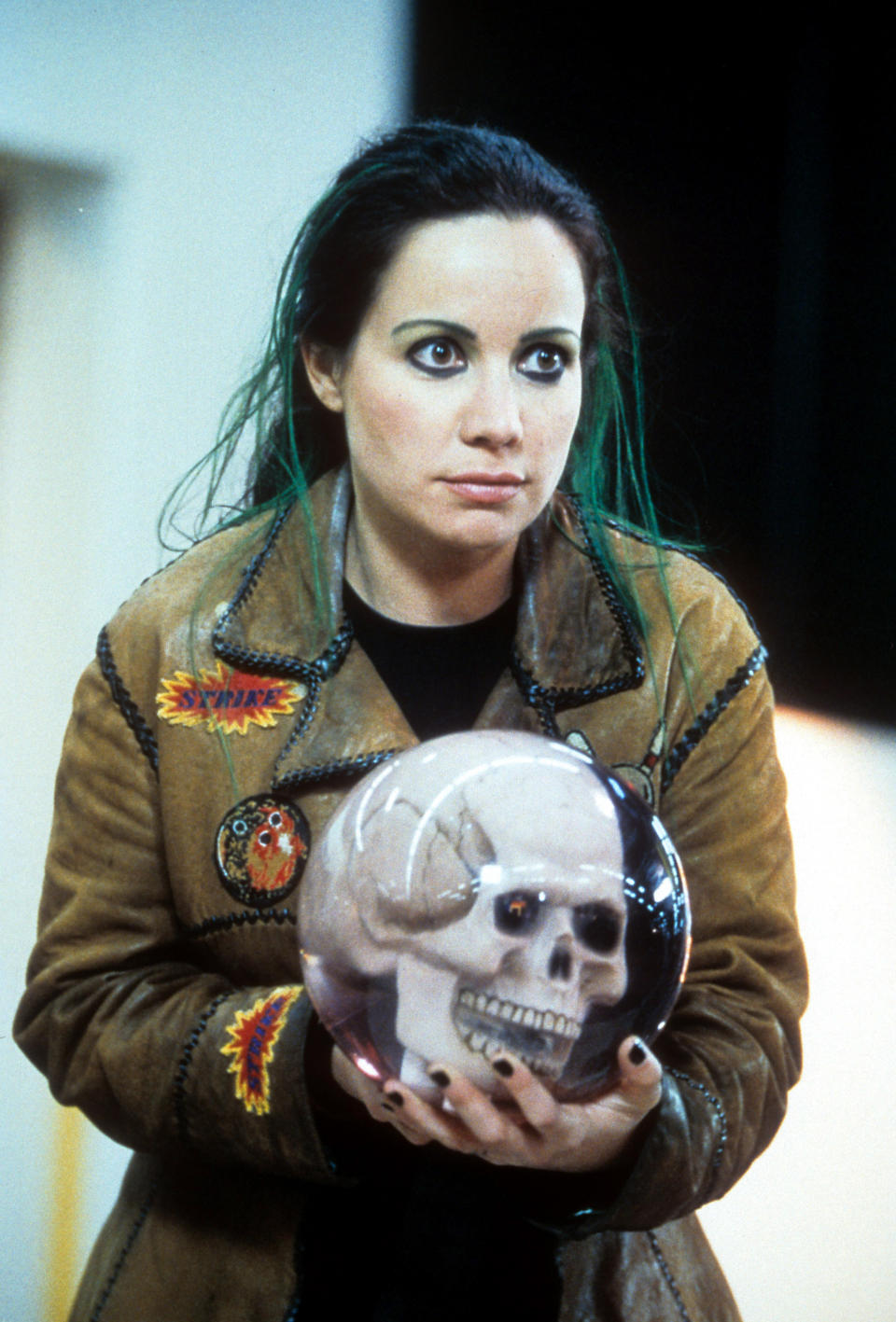 Janeane Garofalo holds an orb in a scene from the film 'Mystery Men', 1999. (Photo by Universal/Getty Images)