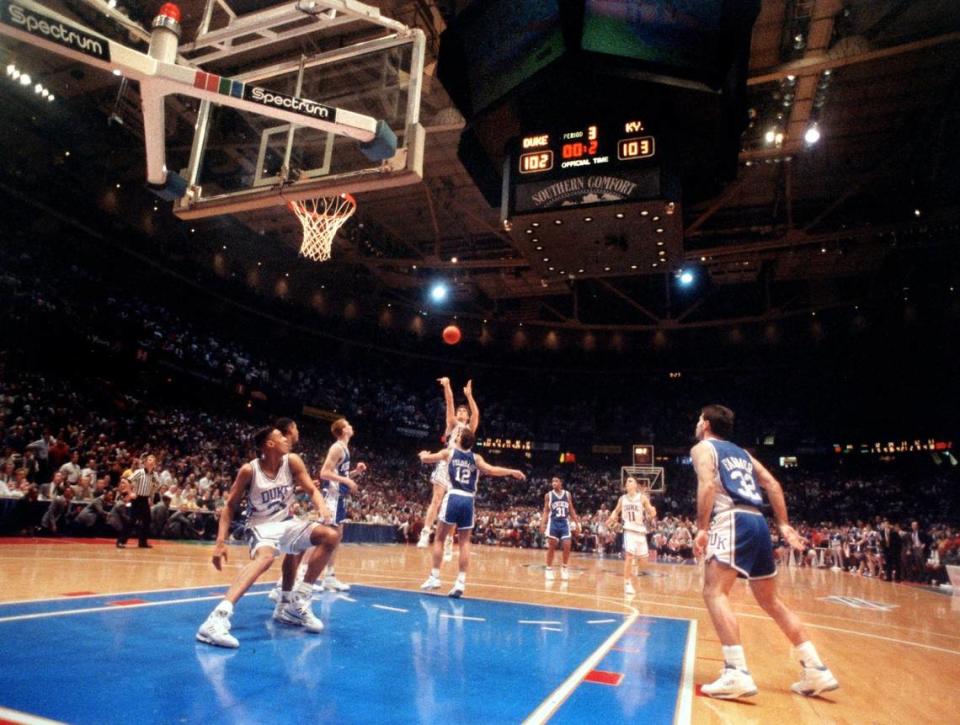 Duke’s Christian Laettner puts up a shot over the University of Kentucky in a last second win in the NCAA Tournament.