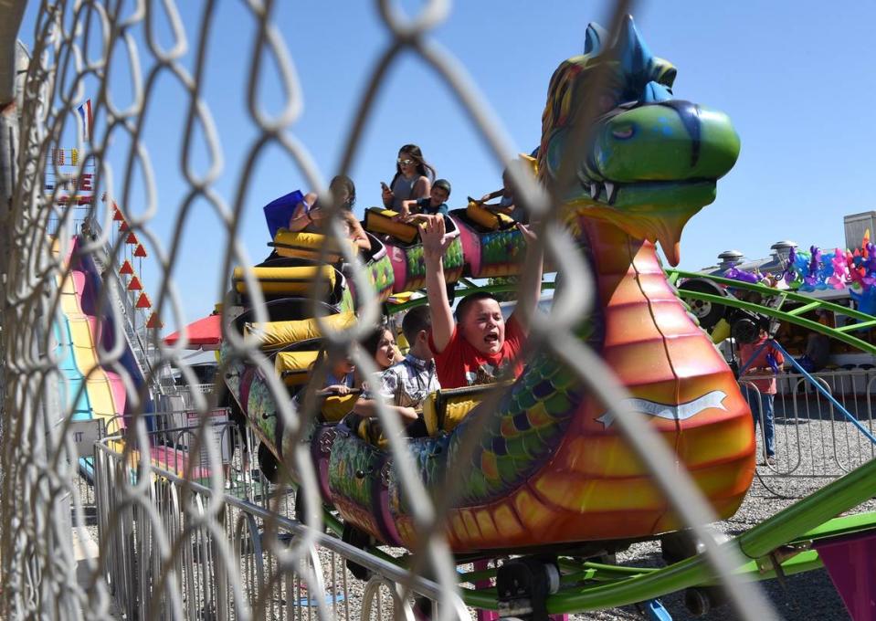 Kids ride a dragon-themed rollercoaster at the 2017 Oakdale Chocolate Festival. The festival has been canceled.