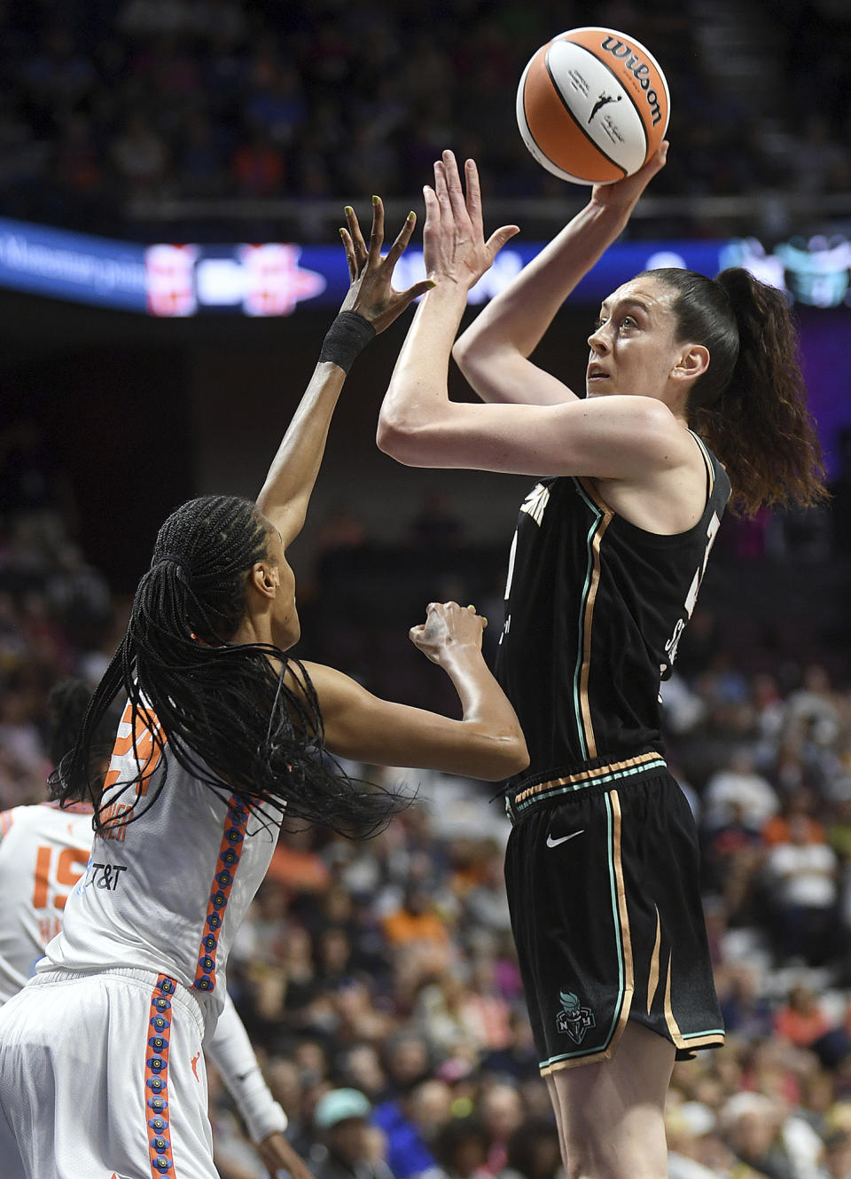 New York Liberty's Breanna Stewart (30) attempts a basket as she is guarded by Connecticut Sun's DeWanna Bonner (24) during the first half of a WNBA basketball game, Tuesday, June 27, 2023 at Mohegan Sun Arena in Uncasville, Conn. (Sarah Gordon/The Day via AP)