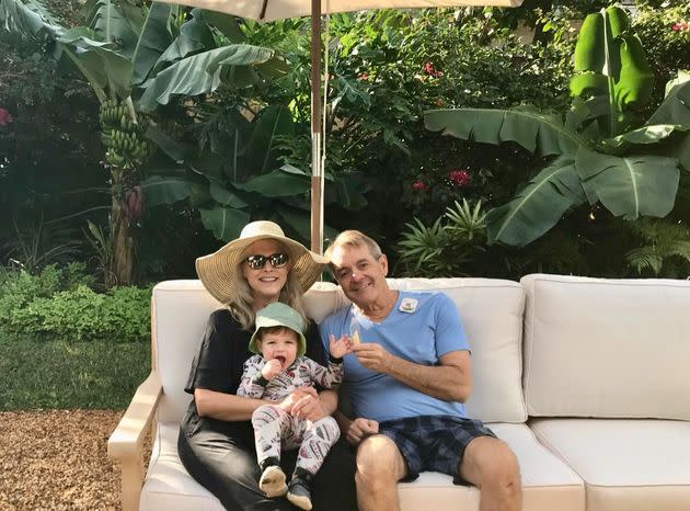 The author and her husband visit with their (COVID-tested) grandson in their backyard in West Palm Beach.