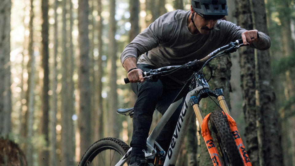 Race Face Era handlebar being ridden on a trail