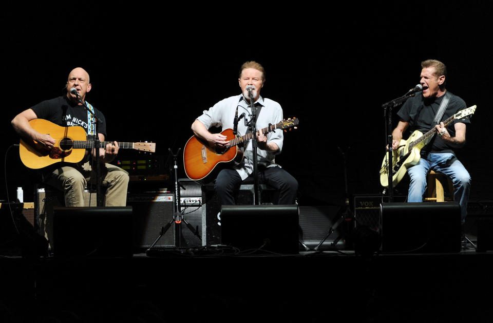 Musicians Bernie Leadon, left, Don Henley and Glenn Frey, right, of the Eagles perform at Madison Square Garden on Friday, Nov. 8, 2013 in New York. (Photo by Evan Agostini/Invision/AP)