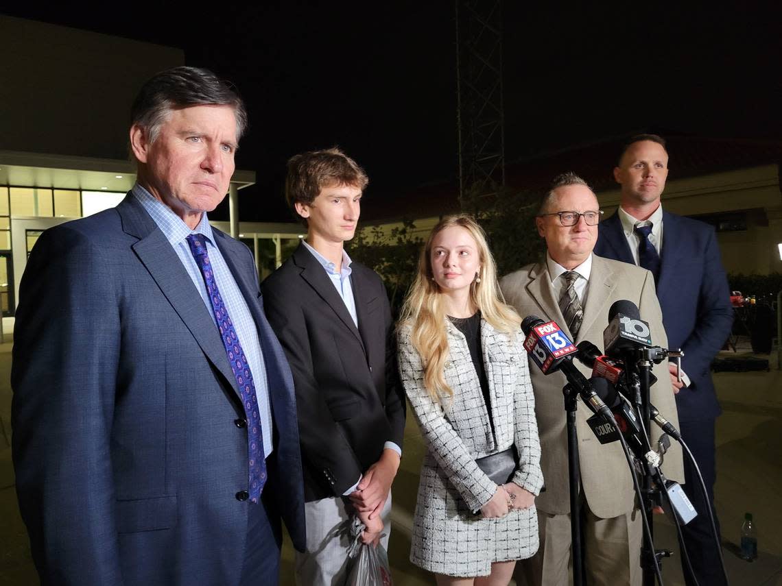 Kyle, Maya and Jack Kowalski stand between their attorneys, Greg Anderson and Nick Whitney, as they address media outside the South Sarasota County Courthouse in Venice, FL, following the conclusion of a two-month trial against Johns Hopkins All Children’s Hospital in which a jury awarded them more than $260 million in compensatory and punitive damages. The Kowalski family sued Johns Hopkins All Children’s Hospital for false imprisonment, negligent infliction of emotional distress, medical negligence, battery, and other claims more than a year after the family matriarch, Beata Kowalski, took her life following allegations she was abusing her daughter, Maya Kowalski.
