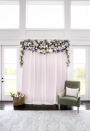 <p>This gorgeous backdrop was crafted with curtains, sheer fabric, faux flowers and greenery — an easy project for bridesmaids to enjoy. </p><p><a href="https://domesticallyblissful.com/diy-wedding-shower-backdrop/" rel="nofollow noopener" target="_blank" data-ylk="slk:Get the tutorial at Domestically Beautiful »" class="link "><em>Get the tutorial at Domestically Beautiful »</em></a></p>