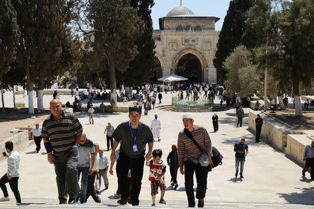 Muslim tourists (front) walk up stairs during their visit to the compound known to Muslims as Noble Sanctuary and to Jews as Temple Mount, in Jerusalem's Old City August 31, 2017. REUTERS/Ammar Awad