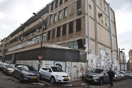 Cars are parked on sidewalks on a street in Tel Aviv February 18, 2015. REUTERS/Nir Elias