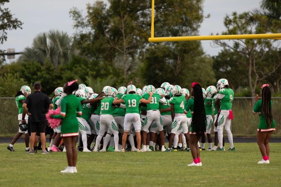 The Atlantic football team gathers in a huddle before playing Seminole Ridge on Friday, Oct. 13, 2023 in Loxahatchee. The Eagles cruised to a 43-13 district victory.