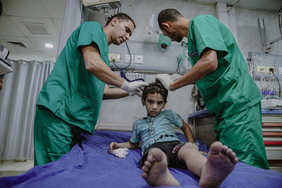 10/13/2023 Gaza, Palestine.. Palestinian children are injured during the bombing of the Gaza Strip on the sixth day of the war on Gaza. (Photo by Saher Alghorra / Middle East Images / Middle East Images via AFP) (Photo by SAHER ALGHORRA/Middle East Images/AFP via Getty Images)