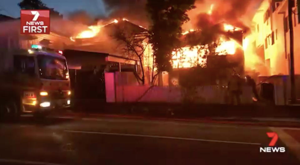 A single candle is believed to have caused two million-dollar homes to go up in flames. Source: 7 News
