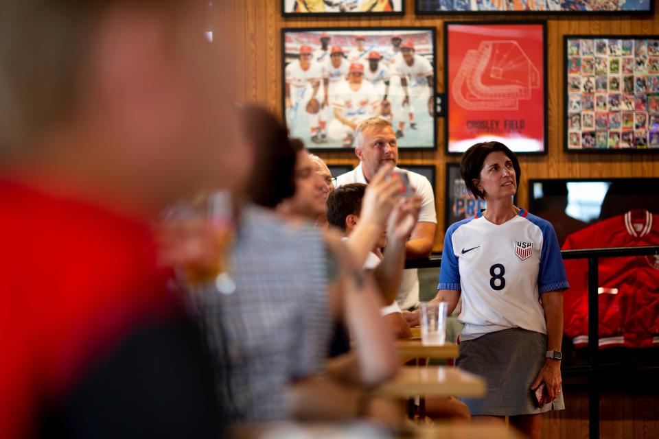 Ali Leverage watches the television broadcast announcing the U.S. Host Cities for the FIFA World Cup 2026 during a watch party at The Pitch in Over-The-Rhine on Thursday, June 16, 2022.