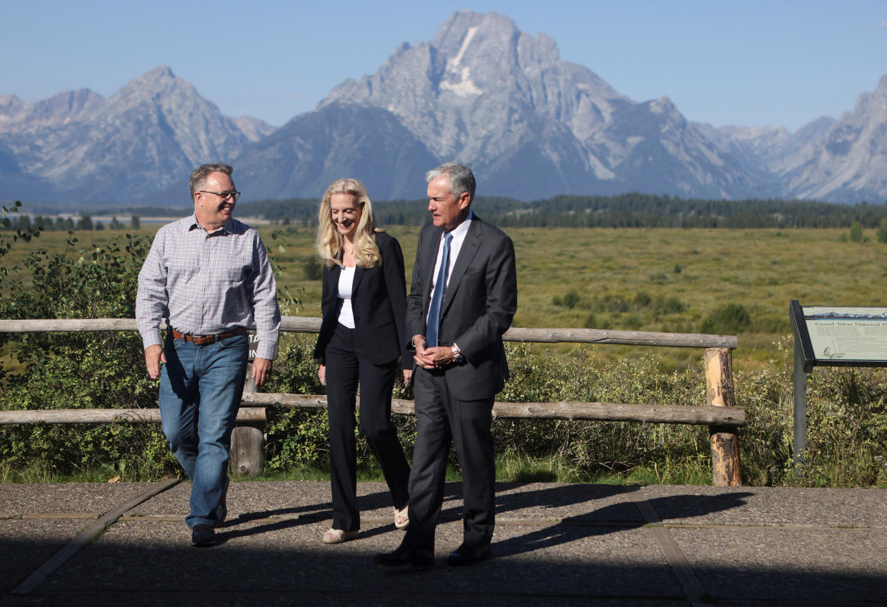 John C. Williams, president and chief executive officer of the Federal Reserve Bank of New York, Lael Brainard, vice chair of the Board of Governors of the Federal Reserve, and Jerome Powell, chair of the Federal Reserve, walk in Teton National Park where financial leaders from around the world gathered for the Jackson Hole Economic Symposium outside Jackson, Wyoming, U.S., August 26, 2022. REUTERS/Jim Urquhart