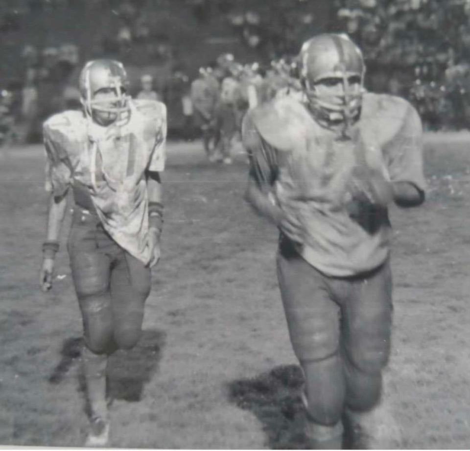 Moody players Abbey Cardenas and Steve Gonzales walk off the field during a game against King at Buc Stadium in 1973.