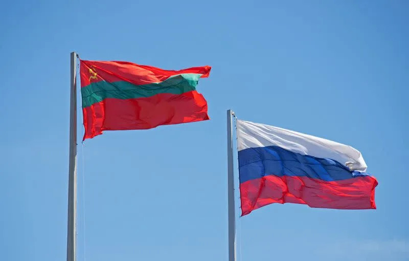 Flags of Moldova's breakaway region of Transdniestria and Russia flutter in central Tiraspol