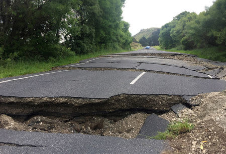 A fractured road caused by an earthquake stops vehicle access 70 kilometers south of Blenheim on New Zealand's South Island, November 14, 2016. REUTERS/Anthony Phelps