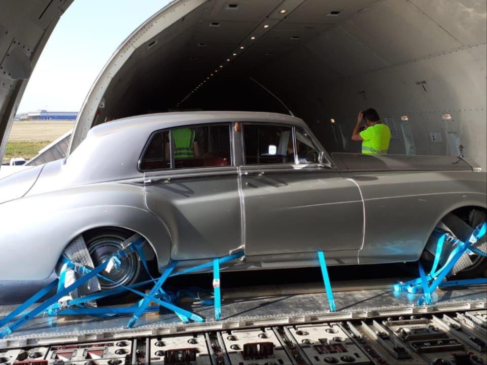 A vintage Rolls Royce 1962 in a cargo plane.