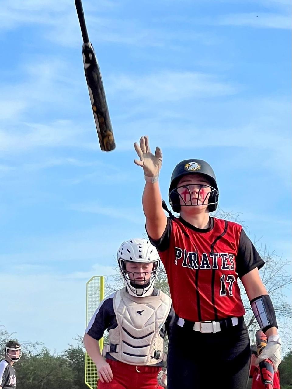 Cardington's Morgan Powell throws a bat back to the on-deck circle during a Knox Morrow Athletic Conference softball game at Centerburg last week.