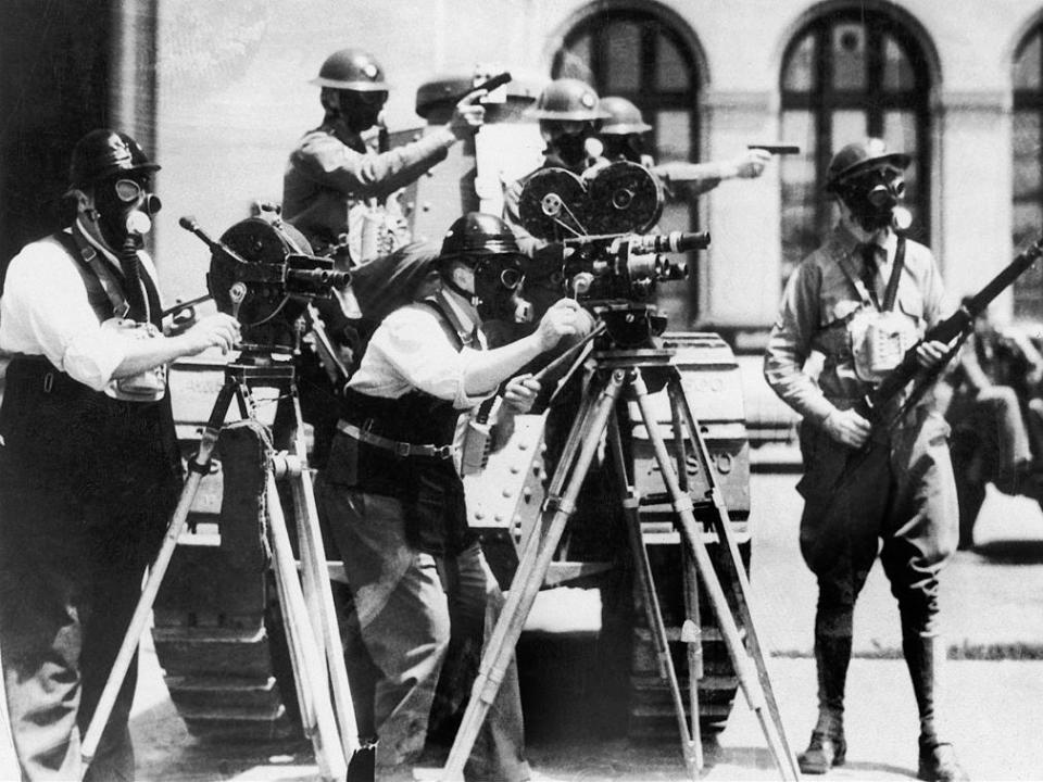 Some Cameramen With Gas Masks Filming The Strike Of Dockers In Seattle on July 3, 1934.