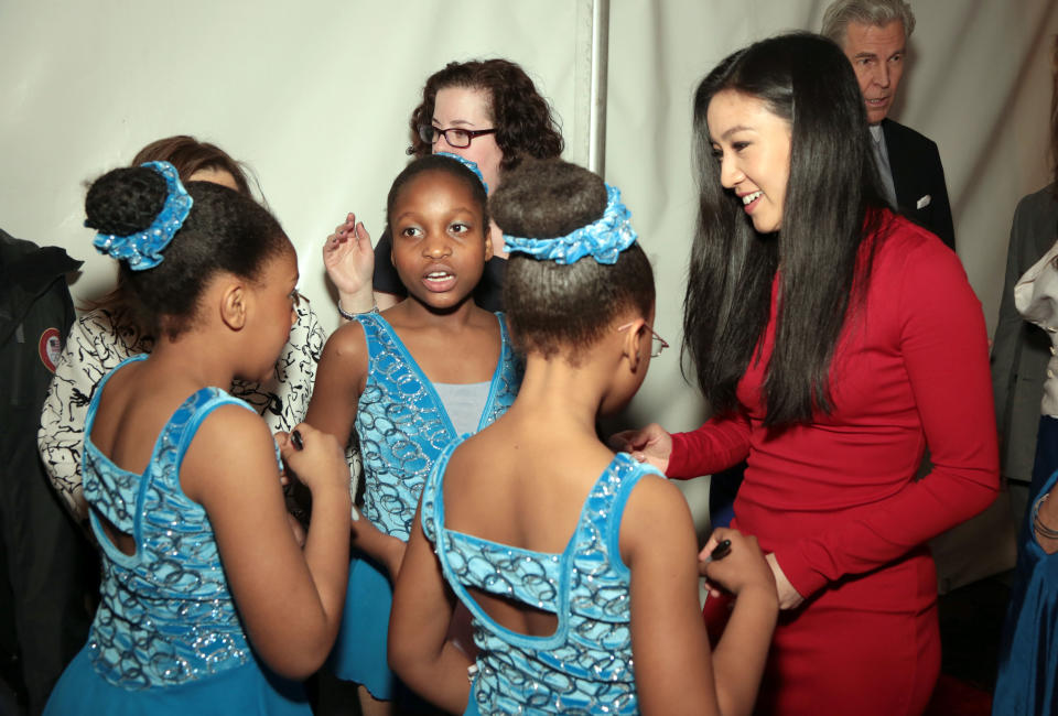 <p>In this April 7, 2014 file photo, Michelle Kwan, right, chats with students from Figure Skating Harlem, Emily Delbrun, left, Amber Stuart, front center, and Emmanuella Tapsoba, second left, during the 2014 Skating with the Stars benefit gala at the Trump Rink in Central Park in New York. Founded in 1997 by Sharon Cohen, who remains its executive director and guiding force, Figure Skating in Harlem’s success story has been built on so much more than getting out on the ice. (Photo by Luiz C. Ribeiro/Invision/AP) </p>