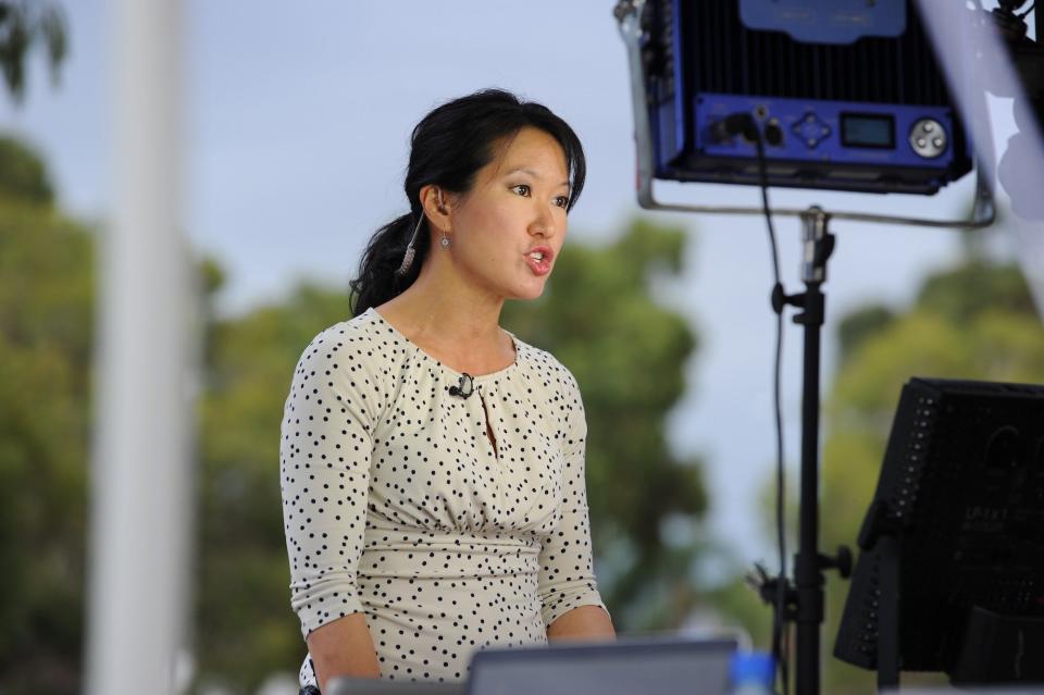 CNN correspondent Kyung Lah speaks on camera at Pearce Airbase in Bullsbrook, 35 kms north of Perth on March 25, 2014, during media coverage of the air and sea search for Malaysia Airlines flight MH370.