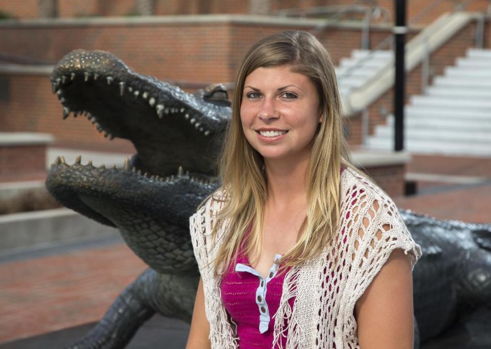 This Jan. 16, 2017 photo shows Danielle Cordes at the University of Florida in Gainesville, Fla. The 22-year-old business major had spent over 17 years inside the Word of Faith Fellowship church. "When you're young, you don't understand what's going on, why they're hitting you," said Cordes, who left in 2013. "You didn’t do anything wrong. You weren't causing trouble, but you think you're a bad person because they're beating you in the name of God." (AP Photo/Ron Irby)