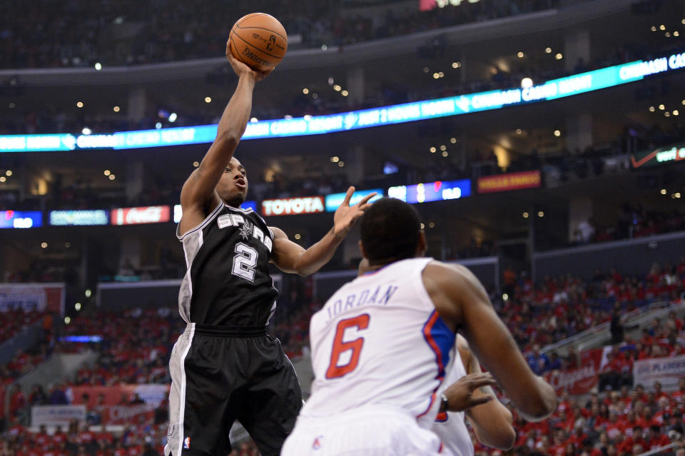 LOS ANGELES, CA - MAY 20: Kawhi Leonard #2 of the San Antonio Spurs shoots the ball over DeAndre Jordan #6 of the Los Angeles Clippers in the first quarter in Game Four of the Western Conference Semifinals in the 2012 NBA Playoffs on May 20, 2011 at Staples Center in Los Angeles, California. NOTE TO USER: User expressly acknowledges and agrees that, by downloading and or using this photograph, User is consenting to the terms and conditions of the Getty Images License Agreement. (Photo by Harry How/Getty Images)