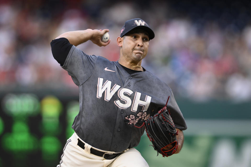 Washington Nationals starting pitcher Paolo Espino throws during the first inning of the team's baseball game against the St. Louis Cardinals, Saturday, July 30, 2022, in Washington. (AP Photo/Nick Wass)