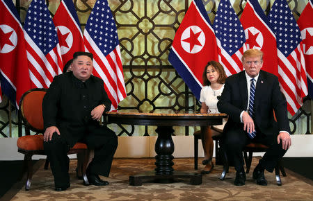 North Korean leader Kim Jong Un and U.S. President Donald Trump listen to questions from the media during the one-on-one bilateral meeting at the second North Korea-U.S. summit in the Metropole hotel in Hanoi, Vietnam February 28, 2019. REUTERS/Leah Millis