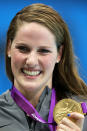 LONDON, ENGLAND - JULY 30: Missy Franklin of the United States celebrates with her gold medal during the medal ceremony for the Women's 100m Backstroke on Day 3 of the London 2012 Olympic Games at the Aquatics Centre on July 30, 2012 in London, England. (Photo by Clive Rose/Getty Images)