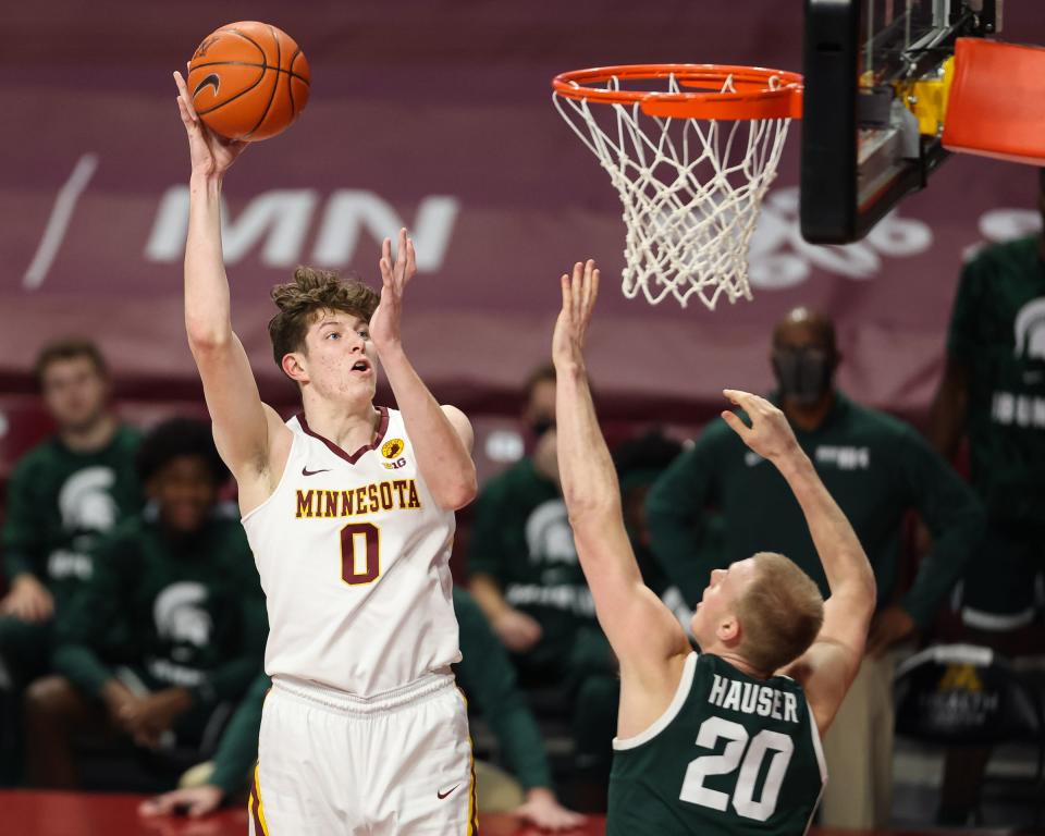 Minnesota Gophers center Liam Robbins (0) shoots the ball over Michigan State Spartans forward Joey Hauser (20) on Dec. 28, 2020, during the first half at Williams Arena.