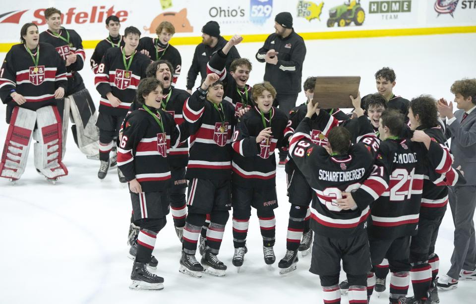 St. Charles celebrates a 4-2 win over Olentangy Liberty in the regional final Saturday at OhioHealth Ice Haus.