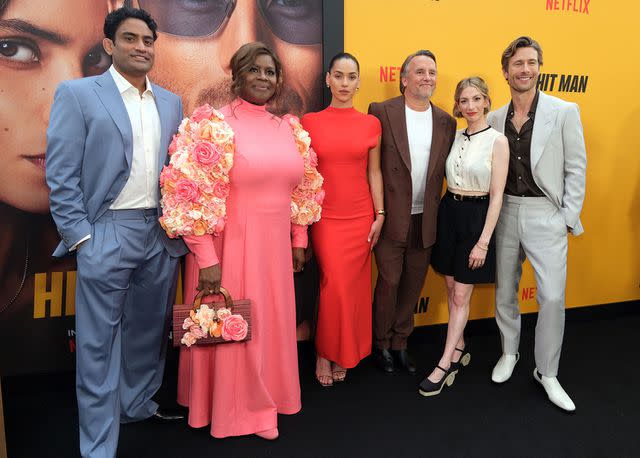 <p>Hubert Vestil/Getty Images</p> From Left: Sanjay Rao, Retta, Adria Arjona, Richard Linklater, Molly Bernard and Glen Powell attend the premiere of Netflix's 'Hit Man' &