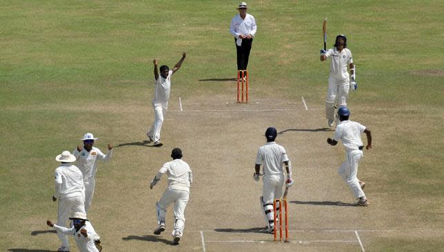 Muralitharan celebrates taking his 800th Test wicket against India in 2010.