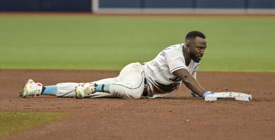 Tampa Bay Rays' Randy Arozarena touches the bag after he was picked off at second base on a throw from Pittsburgh Pirates pitcher JT Brubaker during the fifth inning of a baseball game Saturday, June 25, 2022, in St. Petersburg, Fla. (AP Photo/Steve Nesius)