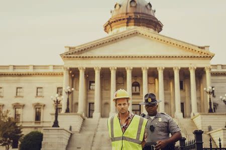 James Tyson is arrested after aiding Bree Newsome to take down the Confederate Flag from a pole at the Statehouse in Columbia, South Carolina, June 27, 2015. REUTERS/Adam Anderson Photo