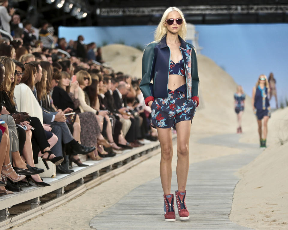 Fashion from the Tommy Hilfiger Spring 2014 collection is modeled on Monday, Sept. 9, 2013 in New York. (AP Photo/Bebeto Matthews)