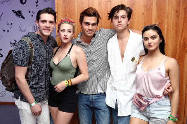 <p>Rich Fury/Getty</p> Casey Cott, Lili Reinhart, KJ Apa, Cole Sprouse and Camila Mendes at Coachella in 2017