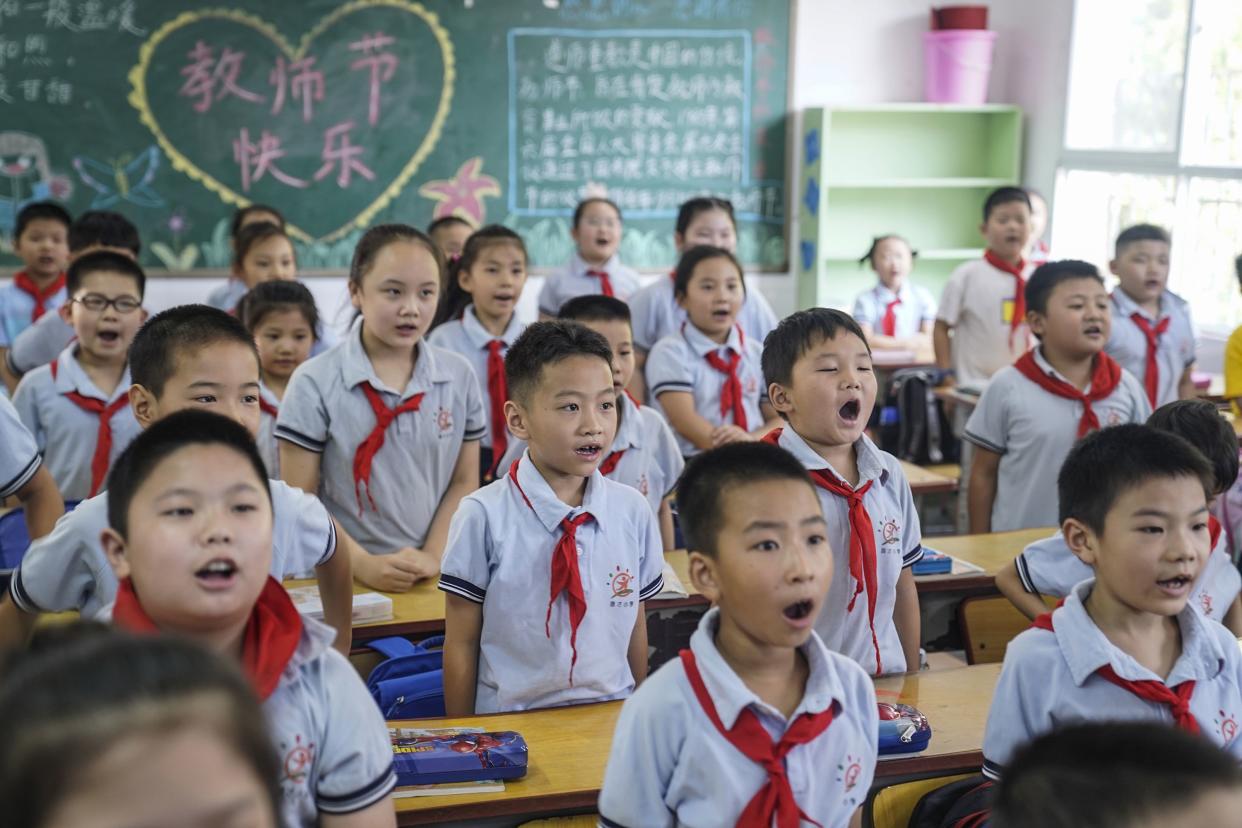 Elementary school students attend a class on the first day of the new semester in Wuhan in China's central Hubei province on Sept. 1, 2020.