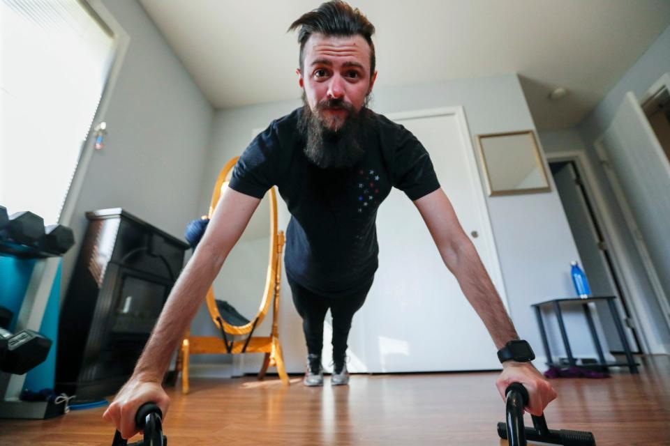 Nic Talbott does pushups during one of his workouts at his home in Lisbon, Ohio, in hopes of being permitted to enlist in the military.
