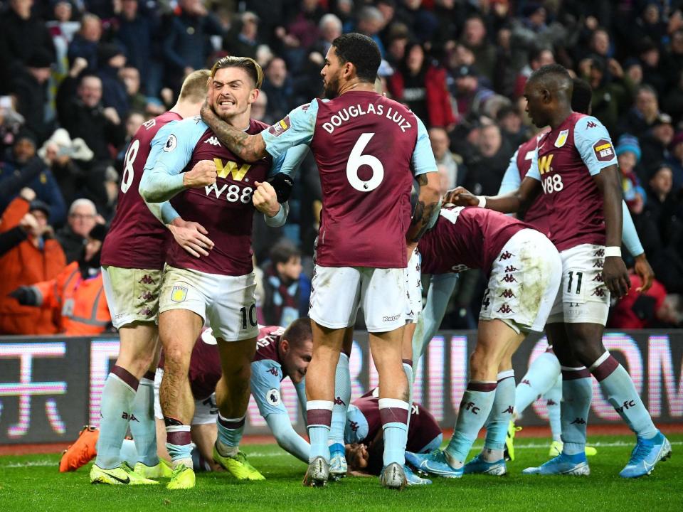 Aston Villa celebrate scoring a late winner against Watford: Getty