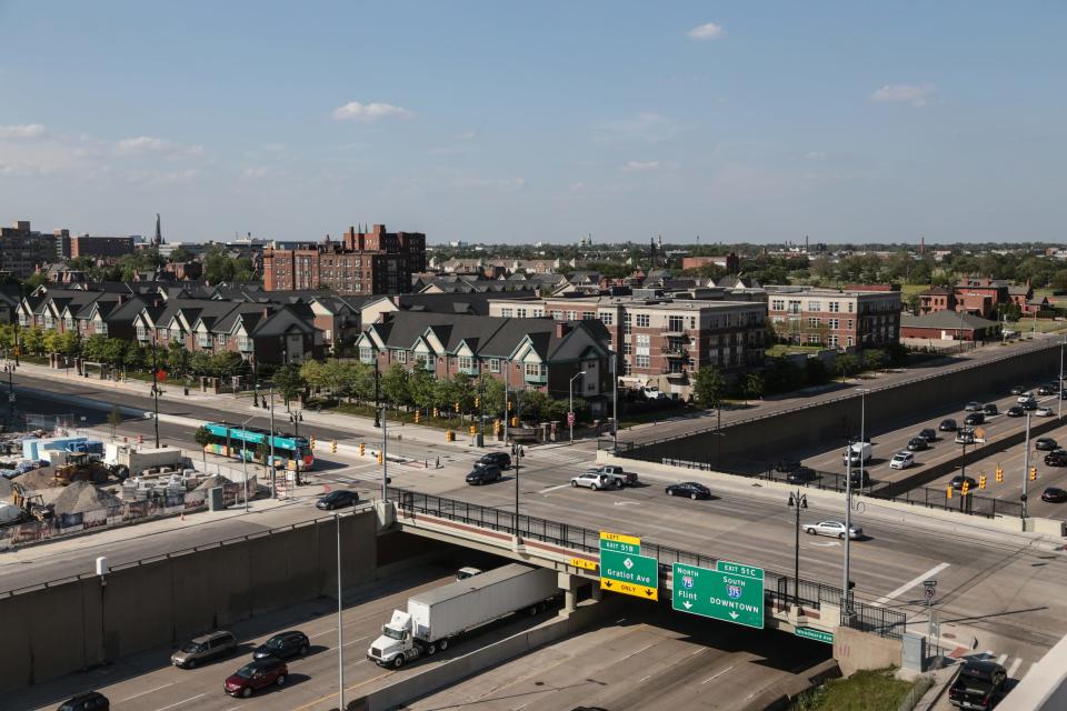 The Brush Park neighborhood is seen as traffic flows along Woodward Avenue in downtown Detroit and Interstate 75 in this 2017 file photo. A $2 million grant for a study announced this week could be a key step toward a potential park over I-75 in this area in the coming years.