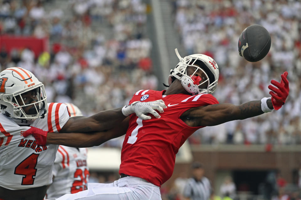 Mississippi wide receiver Ayden Williams (1) misses a pass as Mercer cornerback Tavion McCarthy (4) defends during the first half of an NCAA college football game in Oxford, Miss., Saturday, Sept. 2, 2023. (AP Photo/Thomas Graning)