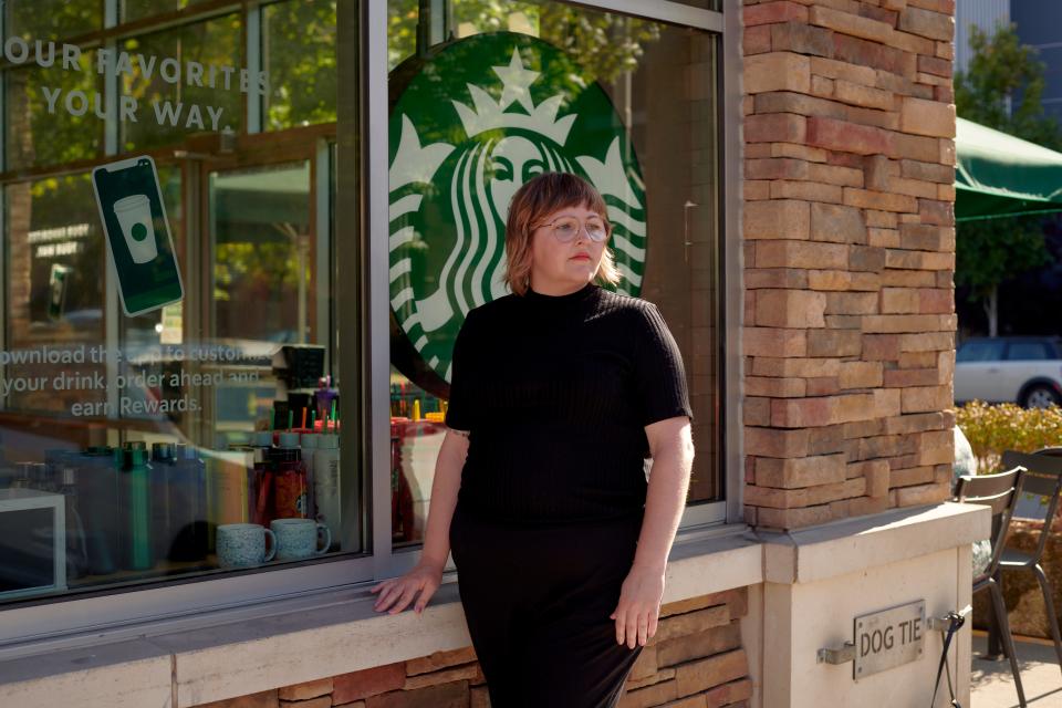 Lindsey Price standing outside in front of a Starbucks.