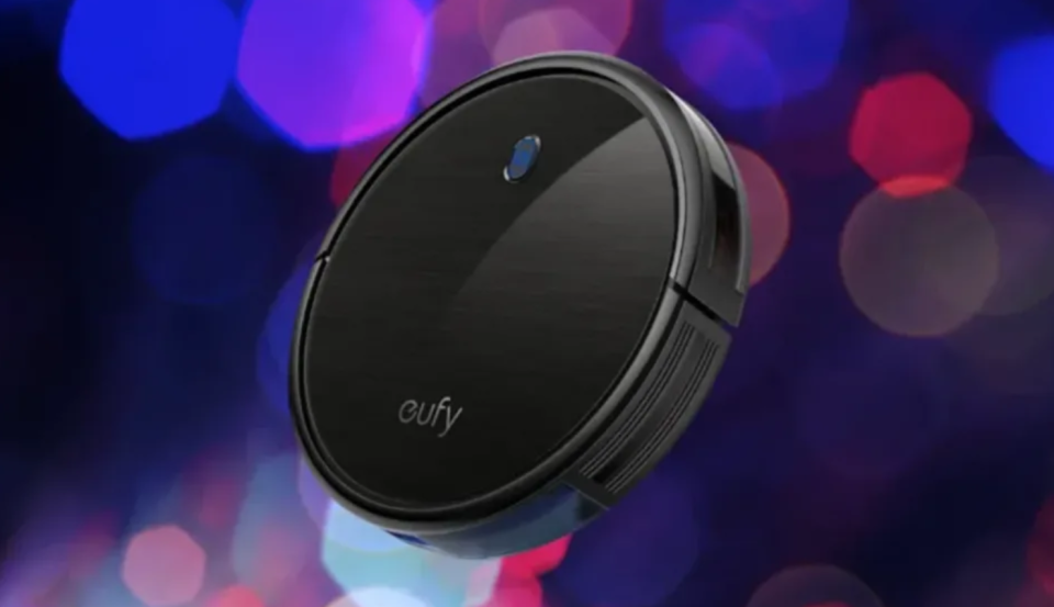 A round black robot vacuum cleaner is shown against a boukeh background; it reads 'eufy'.