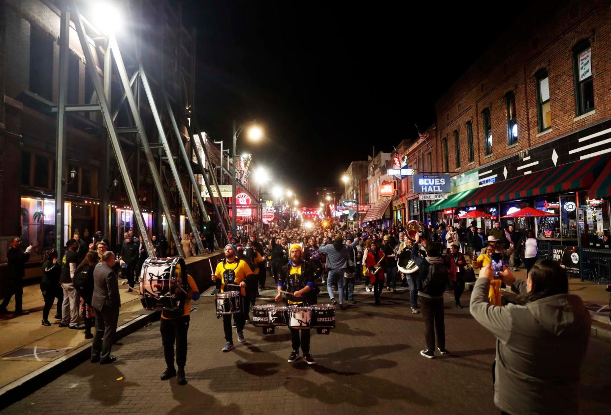 The Grizz Line performs ahead of travel professionals as they parade down Beale Street in Memphis as part of the Travel South International Showcase, hosted by Memphis Tourism, on Monday, Dec. 4, 2023. 400 travel professionals from around the world were in Memphis for the showcase.