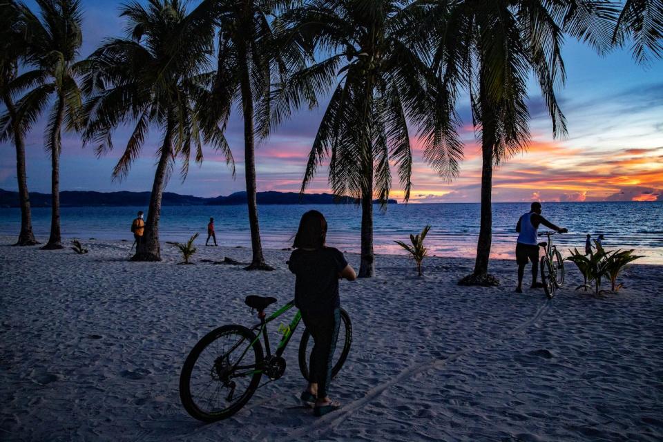 Visitors flock to a beach on September 30, 2020 in Boracay Island, Philippines. 