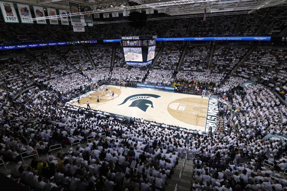 Fans watch the first half of an NCAA college basketball game between Michigan State and Michigan, Saturday, March 9, 2019, in East Lansing, Mich. (AP Photo/Al Goldis)