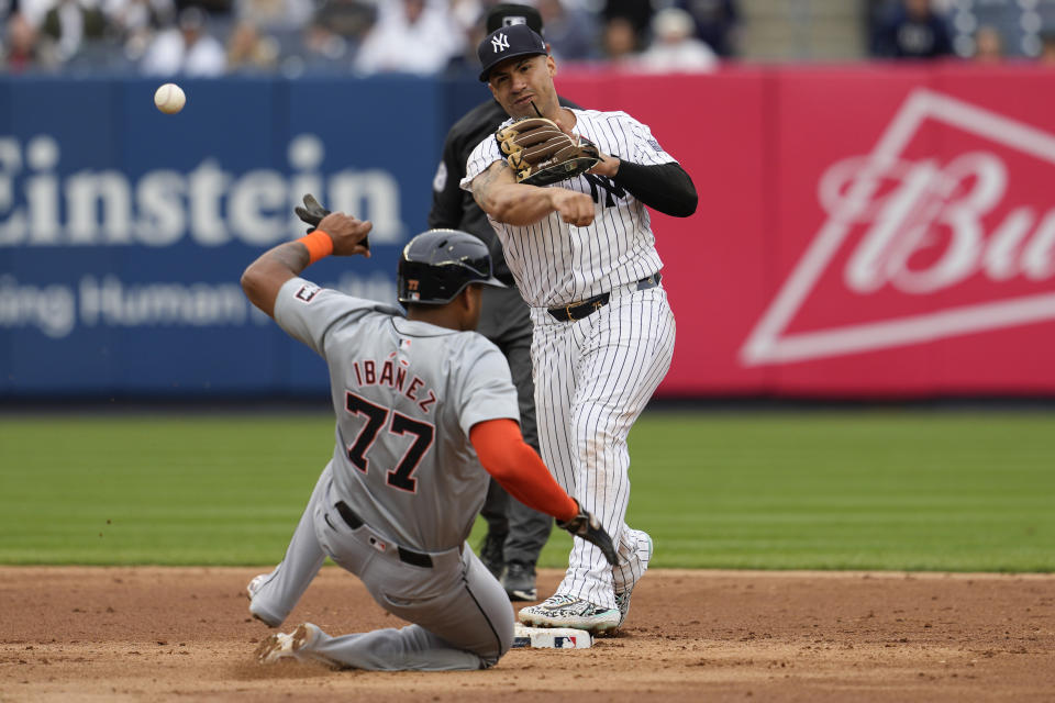 New York Yankees second baseman Gleyber Torres completes a double play after forcing Detroit Tigers' Andy Ibanez (77) out in the ninth inning of a baseball game, Saturday, May 4, 2024, in New York. (AP Photo/Mary Altaffer)