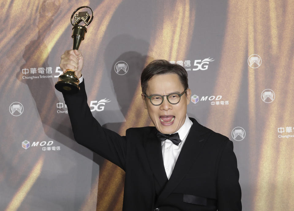 Taiwanese singer Lo Tayou holds his award for Special Contribution Award - Popular Music for the 32nd Golden Melody Awards in Taipei, Taiwan, Saturday, Aug. 21, 2021. Golden Melody Awards, one of the world's biggest Chinese-language pop music annual events and postponed from June to Aug. due to the coronavirus pandemic. (AP Photo/Chiang Ying-ying)