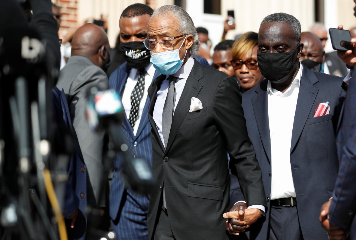 The Reverend Al Sharpton arrives at a news conference outside the Glynn County courthouse with Ahmaud Arbery's parents.